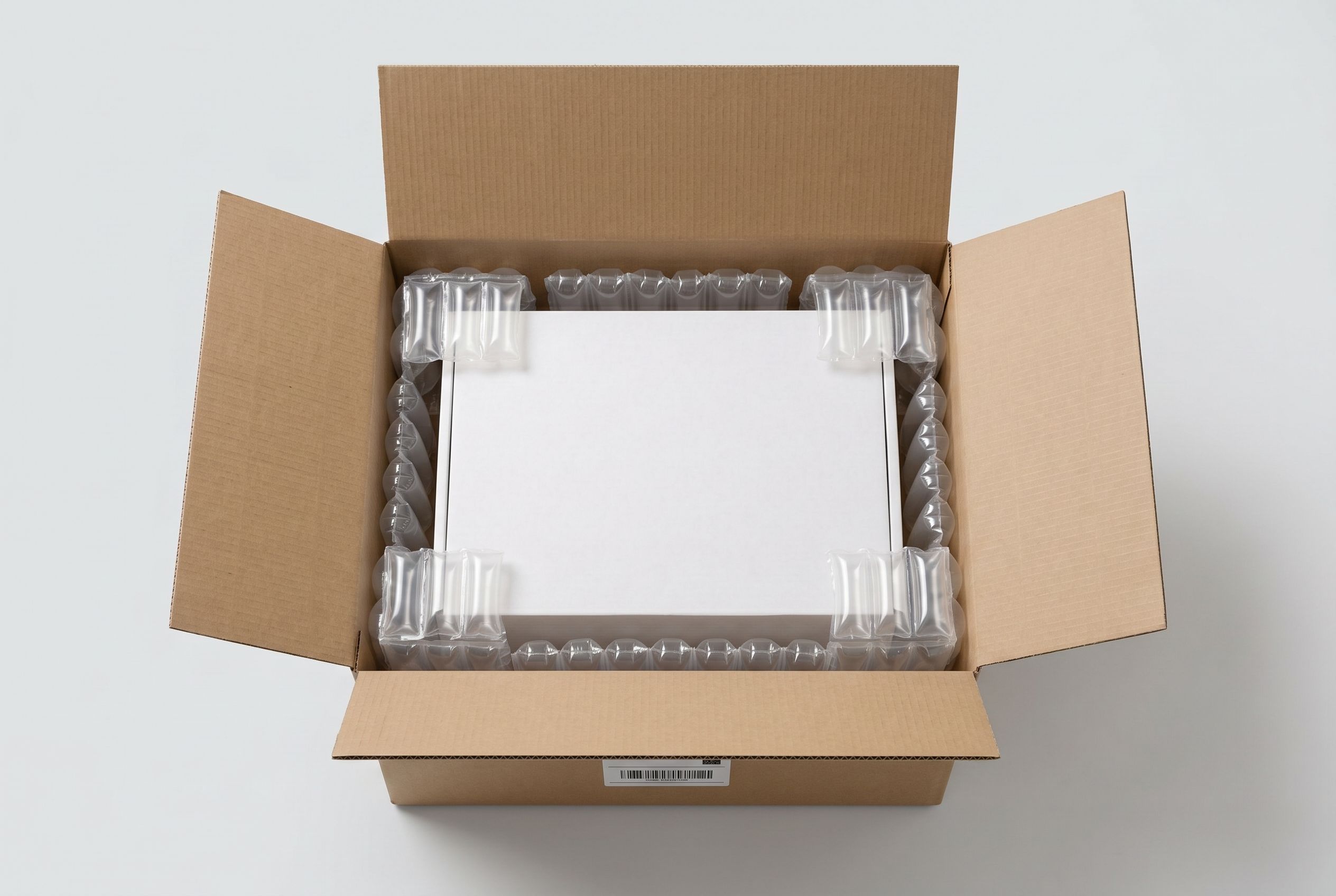 Air cushions and air pillows protecting a product inside a shipping box